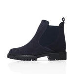 Navy blue Chelsea boot on a white background