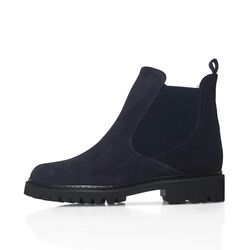 Navy blue Chelsea boot on a white background