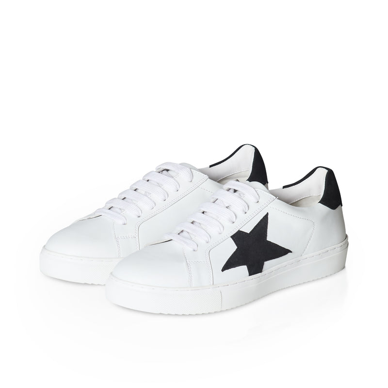White sneakers with black star design on a white background
